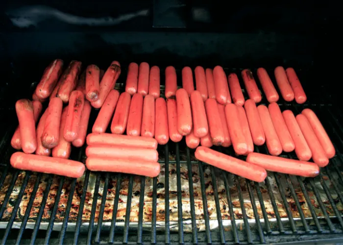 hotdogs on a barbeque grill