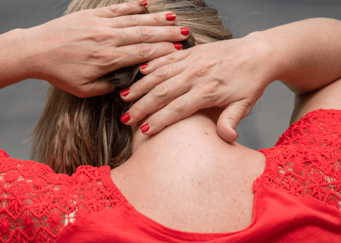 woman in red sufferring a stiff neck