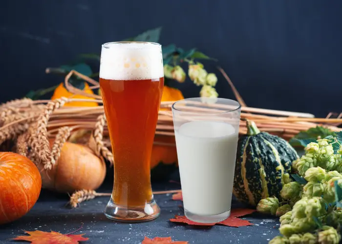 beer and milk on the table sorrounded by vegetables