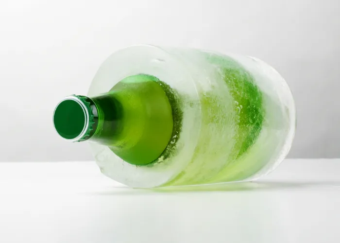 frozen beer bottle on a table