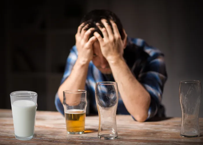 man drinking alcohol and milk